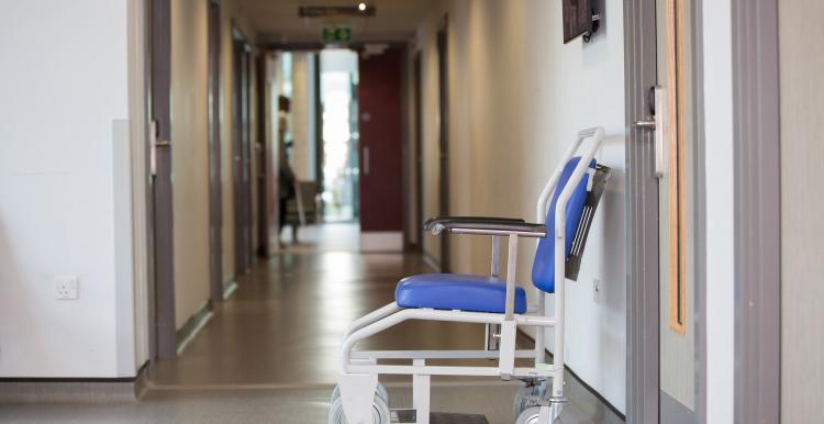 Hospital wheelchair left in a hallway