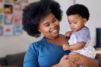 Woman holding her baby